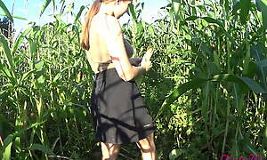 Kate Wood plays with her pussy in a cornfield
