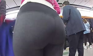Above-board Asian lady's ass in tight yoga pants